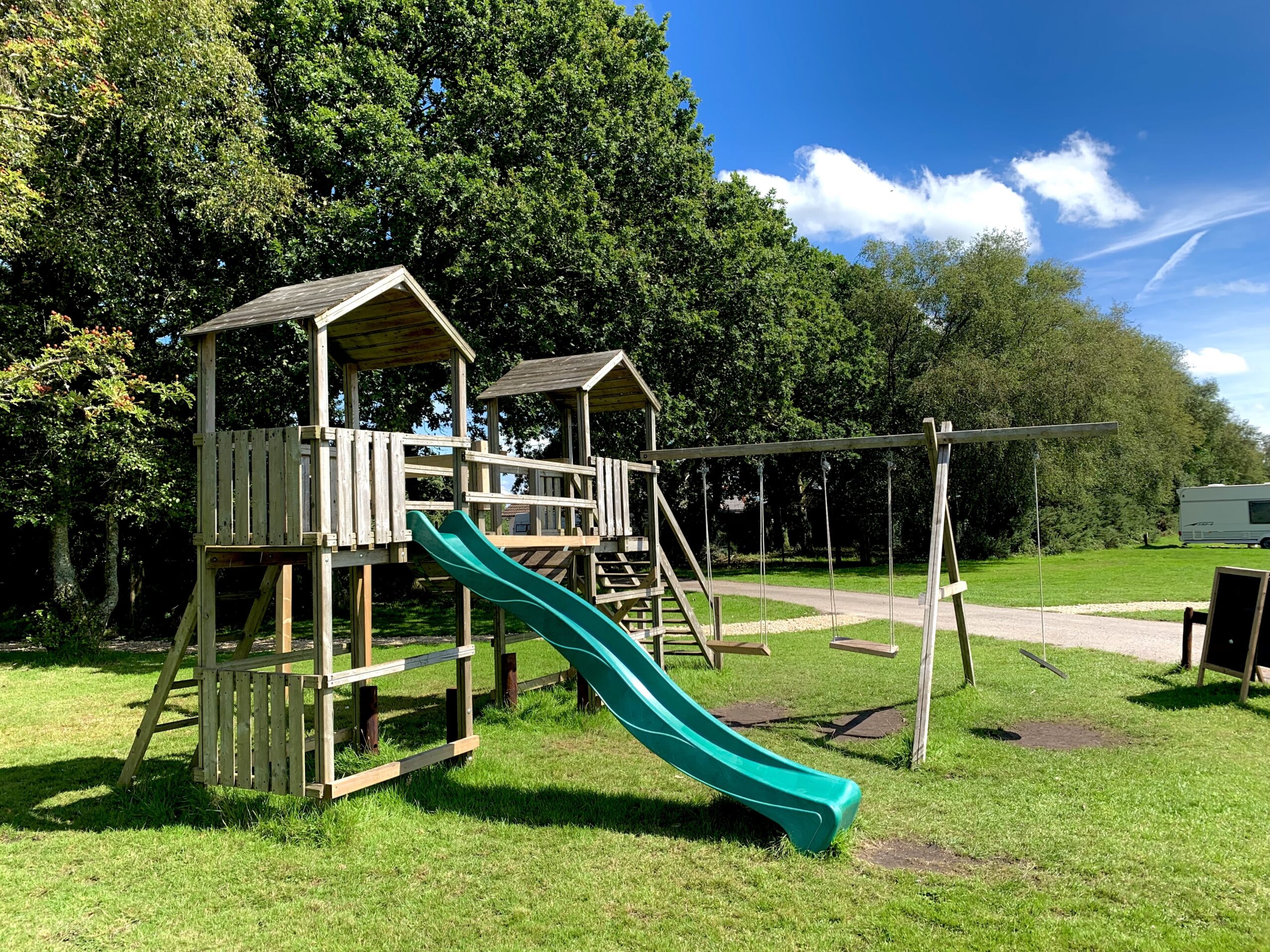 View of well kept, bright green grass seen from the children play tower